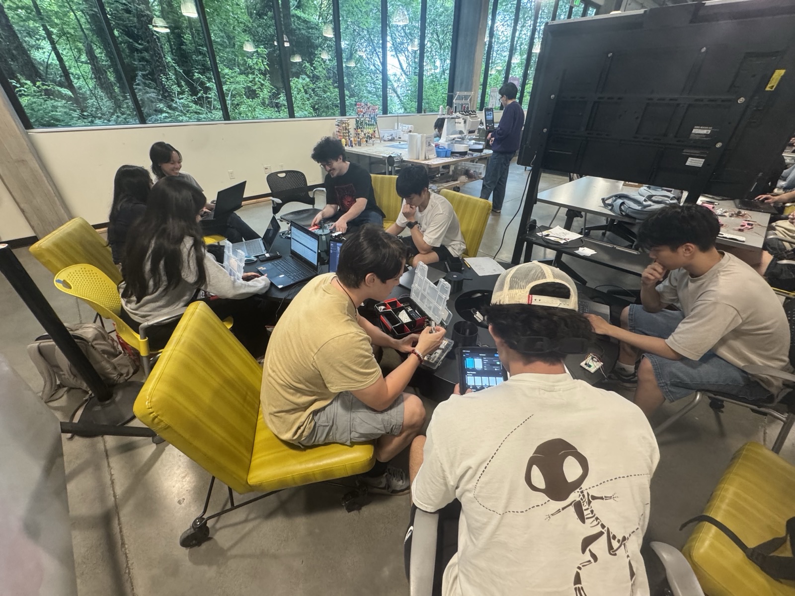 Fitness Tech members building hardware at a club meeting